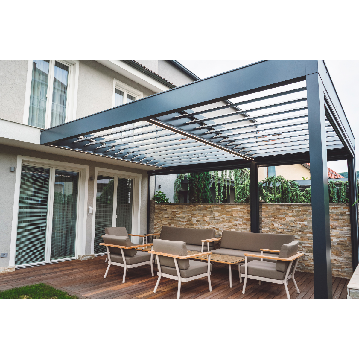 garden furniture under a bioclimatic pergola